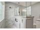 The bathroom features a walk-in shower with glass surround, marble tile, and built in shelving at 280 Oatland Lake Rd., Pawleys Island, SC 29585