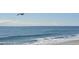 Beautiful view of the beach and ocean, featuring a sandy shoreline and clear blue water at 280 Oatland Lake Rd., Pawleys Island, SC 29585