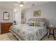 Relaxing bedroom with ceiling fan, blue walls, and patterned bedspread at 280 Oatland Lake Rd., Pawleys Island, SC 29585