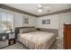 Cozy bedroom features a ceiling fan, decorative wallpaper, and lots of natural light from the window at 280 Oatland Lake Rd., Pawleys Island, SC 29585