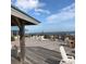 Relaxing deck with ocean views, featuring outdoor seating and a tranquil atmosphere at 280 Oatland Lake Rd., Pawleys Island, SC 29585