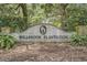 Welcoming entrance sign for Willbrook Plantation surrounded by lush greenery and foliage at 280 Oatland Lake Rd., Pawleys Island, SC 29585