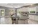 Spacious kitchen with a large island, granite countertops, stainless steel appliances, and lots of natural light at 280 Oatland Lake Rd., Pawleys Island, SC 29585