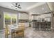 Eat-in kitchen with stainless steel appliances, breakfast bar, and modern lighting at 280 Oatland Lake Rd., Pawleys Island, SC 29585