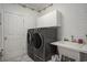 Functional laundry room with front load washer and dryer and sink at 280 Oatland Lake Rd., Pawleys Island, SC 29585
