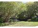 Scenic pond with a bridge surrounded by lush greenery, trees, and a serene atmosphere at 280 Oatland Lake Rd., Pawleys Island, SC 29585