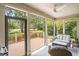 Spacious porch overlooking a scenic golf course and outdoor seating at 280 Oatland Lake Rd., Pawleys Island, SC 29585