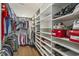 Large walk-in closet with custom shelving and hanging storage at 280 Oatland Lake Rd., Pawleys Island, SC 29585