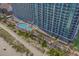 Stunning aerial view of the beachfront resort and large outdoor pool at 3000 N Ocean Blvd. # 230, Myrtle Beach, SC 29577