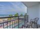 Balcony view of the pool, beach and ocean, complete with seating area at 3000 N Ocean Blvd. # 230, Myrtle Beach, SC 29577