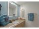 Well-lit bathroom with granite vanity, decorative accents, and stacked towels at 3000 N Ocean Blvd. # 230, Myrtle Beach, SC 29577
