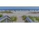 Direct beach access from the property via well-maintained stairs and sandy path, inviting guests to enjoy the ocean at 3000 N Ocean Blvd. # 230, Myrtle Beach, SC 29577