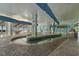 Indoor lazy river with muraled walls, tropical decor, and ample seating overlooking the outdoor pool area at 3000 N Ocean Blvd. # 230, Myrtle Beach, SC 29577