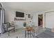 Bright living area with modern furniture, decor, wall-mounted television, and an adjacent dining area near kitchen at 3000 N Ocean Blvd. # 230, Myrtle Beach, SC 29577