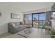 Inviting living room with a beachfront view, cozy seating, contemporary design, and bright natural lighting at 3000 N Ocean Blvd. # 230, Myrtle Beach, SC 29577