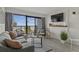 Living room with stylish gray couch, beachfront view, and contemporary accents offers a relaxed atmosphere at 3000 N Ocean Blvd. # 230, Myrtle Beach, SC 29577
