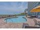 Inviting outdoor pool area with ample lounging and views of the ocean at 3000 N Ocean Blvd. # 230, Myrtle Beach, SC 29577