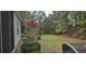 Beautiful backyard with mature trees and lush landscaping offers privacy at 309 Outboard Dr., Murrells Inlet, SC 29576