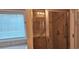 Bathroom with walk-in shower with glass door and accessible features near window at 309 Outboard Dr., Murrells Inlet, SC 29576