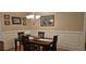 Cozy dining room featuring hardwood floors, classic wainscoting, and elegant chandelier at 309 Outboard Dr., Murrells Inlet, SC 29576