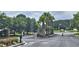 Gated community entrance offering security and privacy with mature trees in the background at 309 Outboard Dr., Murrells Inlet, SC 29576