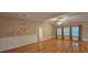 Bright and spacious living room featuring hardwood floors, wainscoting, and large windows at 309 Outboard Dr., Murrells Inlet, SC 29576