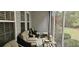 Inviting screened porch with comfortable seating, perfect for relaxation and enjoying the outdoors at 309 Outboard Dr., Murrells Inlet, SC 29576