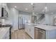 Modern kitchen with stainless appliances, white cabinets, a center island with a sink and white countertops at 315 River Edge Dr., Myrtle Beach, SC 29588
