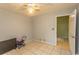 Bedroom features neutral walls, a ceiling fan, and a tiled floor at 318 Muirfield Rd., Myrtle Beach, SC 29588