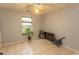 Bedroom features neutral walls, a ceiling fan, and a tiled floor at 318 Muirfield Rd., Myrtle Beach, SC 29588
