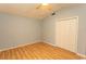 Cozy bedroom with a ceiling fan, wooden floors and a spacious closet at 318 Muirfield Rd., Myrtle Beach, SC 29588