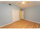 This bedroom features neutral walls, a ceiling fan, and a closet for ample storage at 318 Muirfield Rd., Myrtle Beach, SC 29588