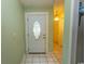Inviting entryway featuring tiled flooring, a decorative front door and neutral wall paint at 318 Muirfield Rd., Myrtle Beach, SC 29588