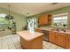 Bright kitchen with stainless steel appliances, center island, and view of the backyard at 318 Muirfield Rd., Myrtle Beach, SC 29588