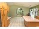 Spacious kitchen featuring a large island, tile floors, and ample natural light from the backyard view at 318 Muirfield Rd., Myrtle Beach, SC 29588