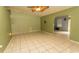View of the living room with tile flooring, ceiling fan, and ample space for relaxation at 318 Muirfield Rd., Myrtle Beach, SC 29588