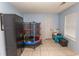 Playroom with a trampoline, storage cabinet, and tile floors, offering a fun and organized space at 318 Muirfield Rd., Myrtle Beach, SC 29588