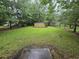 Spacious backyard featuring green lawn, storage shed, and partial fence at 331 Dixon St., Mullins, SC 29574