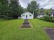 Charming one-story home with a walkway leading to the front door and green shutters at 331 Dixon St., Mullins, SC 29574