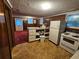 View of a simple kitchen with a partial countertop divider and older appliances at 331 Dixon St., Mullins, SC 29574