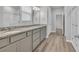 Bathroom featuring double sinks, granite countertops, gray cabinets, and wood-look flooring at 346 High Falls Dr., Conway, SC 29526