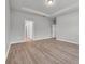 Spacious bedroom featuring wood-look flooring, tray ceiling, and neutral color scheme at 346 High Falls Dr., Conway, SC 29526