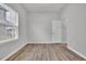 Simple bedroom with neutral walls, stylish flooring, and a sunlit window at 346 High Falls Dr., Conway, SC 29526
