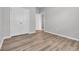 Bedroom with neutral walls, stylish flooring, closet, and bright open doorway at 346 High Falls Dr., Conway, SC 29526