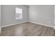Bright bedroom featuring modern flooring and a window with pleasant natural light at 346 High Falls Dr., Conway, SC 29526