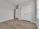 Neutral bedroom with wood-look floors, closet, and bright open doorway at 346 High Falls Dr., Conway, SC 29526