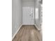 Inviting entryway with wood-look floors, white trim, and natural light streaming through the sidelight at 346 High Falls Dr., Conway, SC 29526