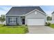 Charming single-story home features a two-car garage, manicured lawn, and stylish curb appeal at 346 High Falls Dr., Conway, SC 29526