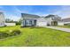 Well-maintained property featuring lush green lawn, landscaped flower beds, and a cozy neighborhood setting at 346 High Falls Dr., Conway, SC 29526