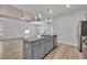 Kitchen island with granite countertop, stainless steel sink, dishwasher, and stylish pendant lighting at 346 High Falls Dr., Conway, SC 29526